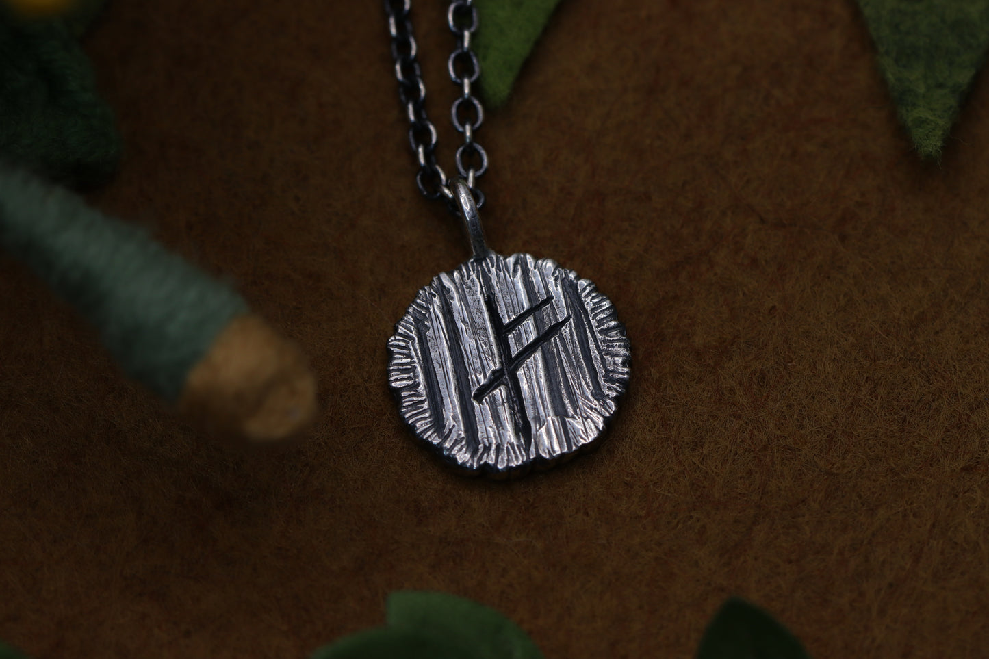 A hobbit house door from The Lord of the Rings marked with a certain wizard's Rune.