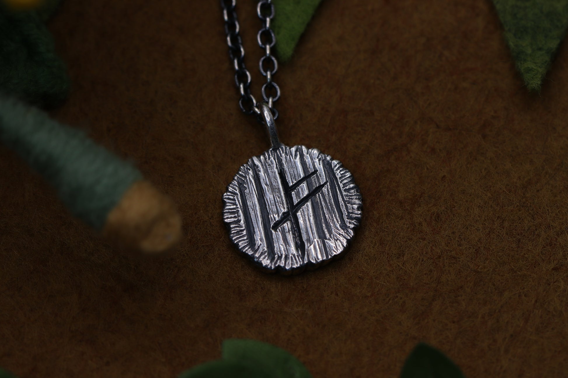 A hobbit house door from The Lord of the Rings marked with a certain wizard's Rune.