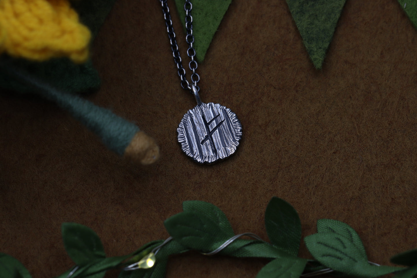 A hobbit house door from The Lord of the Rings marked with a certain wizard's Rune.