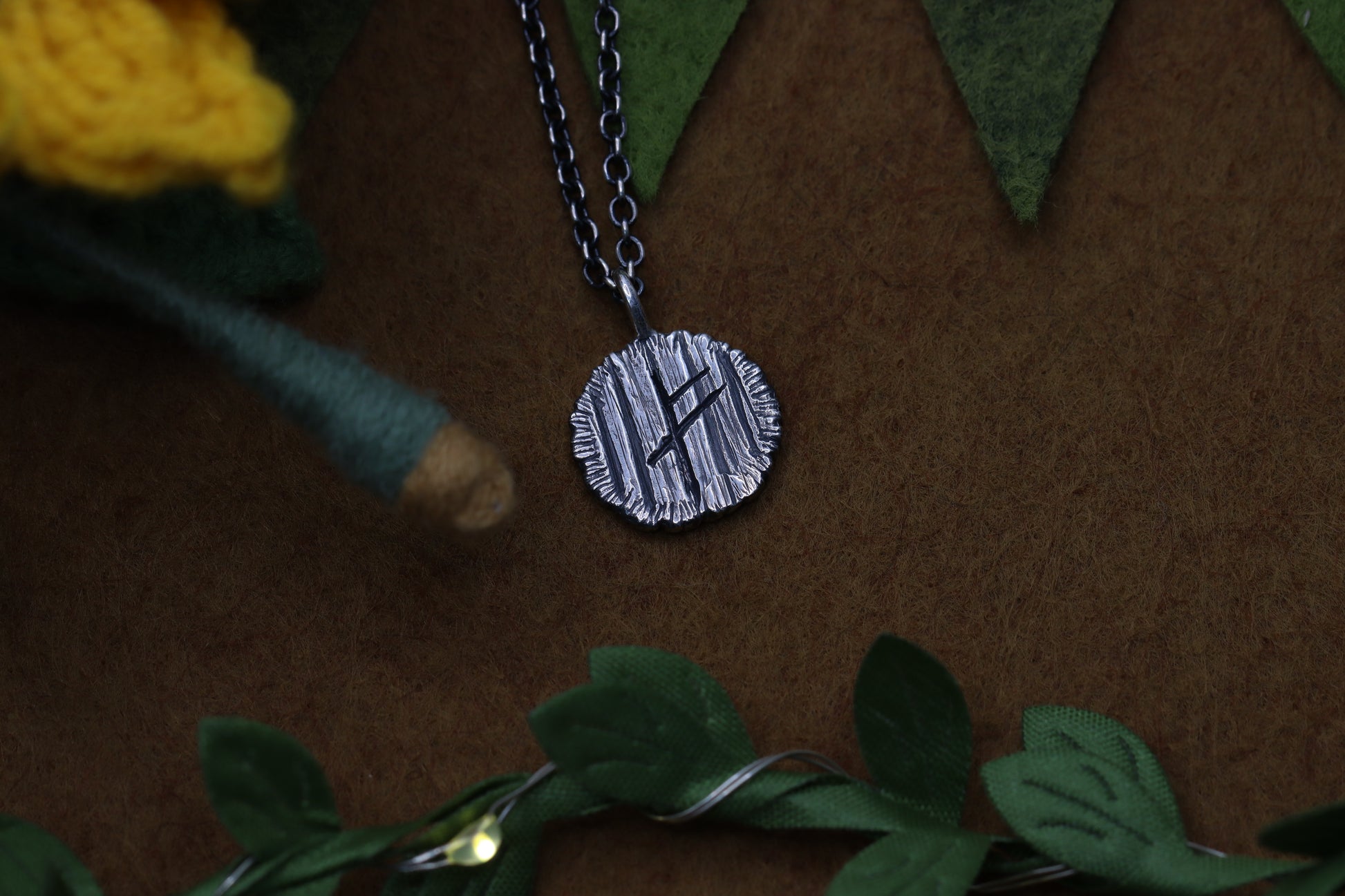 A hobbit house door from The Lord of the Rings marked with a certain wizard's Rune.
