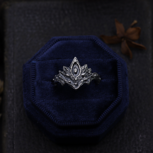 Silver Firekeepers Ring on a dark background