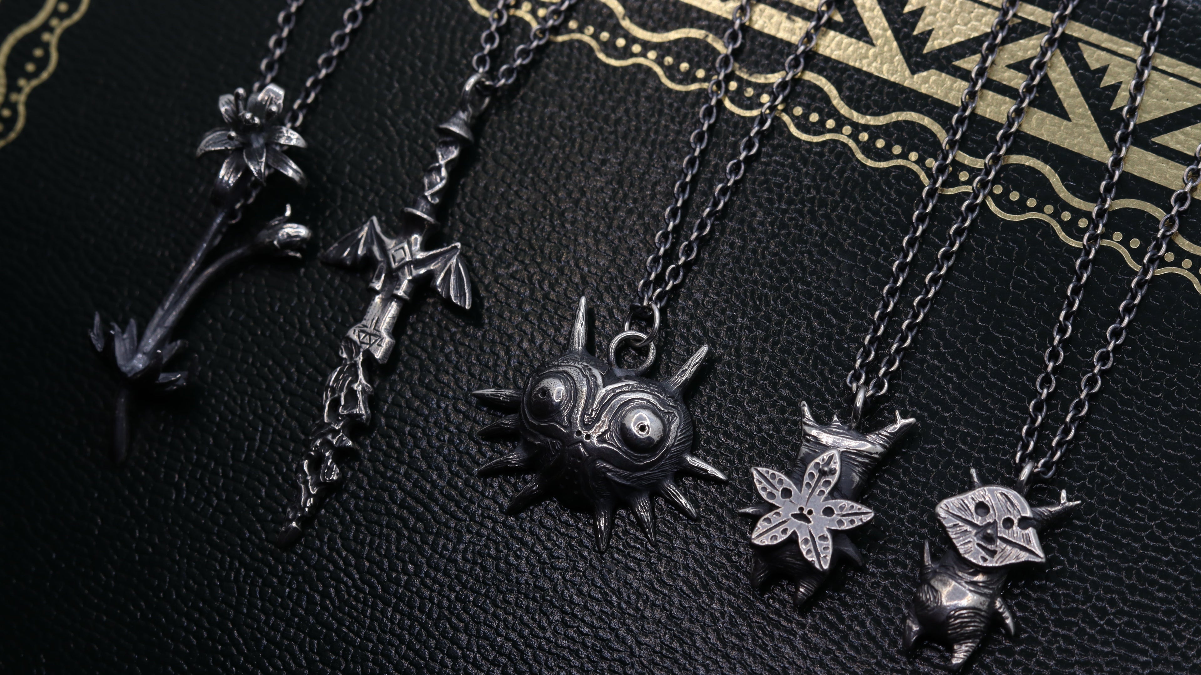 Multiple hand-sculpted sterling silver pieces inspired by The Legend of Zelda.